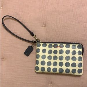 Leather polka dot cream colored coach wristlet